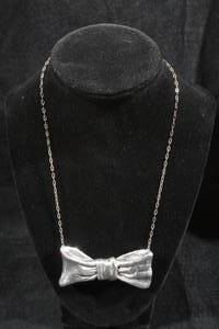 lot 144 image: Large Bow Pendant with Chain - Sterling Silver