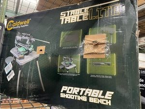 lot 31 image: Caldwell Stable Table Lite with Weatherproof Tabletop, Ambidextrous Seat and Fully Collapsible Design for Easy Transport and Outdoor Target Shooting - BRAND NEW - RETAIL PRICE $169.99