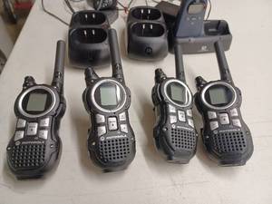lot 13 image: Two Pair of Motorola Walkie-Talkies with Chargers and a Single Audiovox Walkie with Charger - missing cord