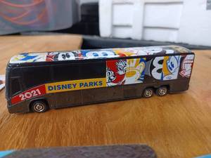 lot 29 image: Seven New Traffic Stoppers Toy Cars, One Each New Sport Wheels and Dyna Wheels Toy Cars, and a Matchbox 2013 MCI J4500 Disney Parks Touring BusMotorcoach 2021