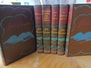 lot 42 image: Six Volume Set of Collier Hard Cover Classics by John Steinbeck The Grapes of Wrath, Tortilla Flat, Cup of Gold, In Dubious Battle, Of Mice and Men, The Moon is Down and Short Stories
