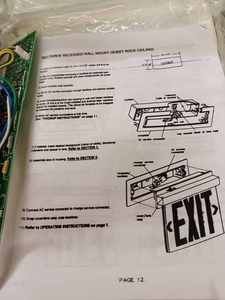lot 84 image: New - In the - Box Lighted Exit Sign and a Like New Ceiling Light Fixture with Frosted Globe