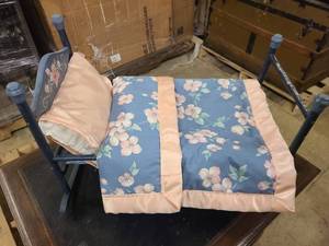 Locally made hand painted doll sized bed with hand sewn blanket and pillow