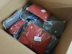 Box of Dog Fleece vests, various sizes