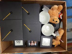 Box of grad gear and extras