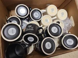 Box of new coffee mugs