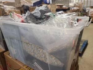 Storage bin of new clothing still in wrap, mostly womens
