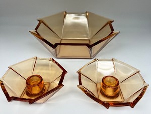 lot 147 image: GEORGE SAKIER For Fostoria - Geometric Amber Glass Bowl and Pair of Candlesticks
