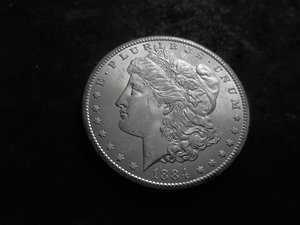 lot 16 image: 1884 CC Morgan Silver Dollar