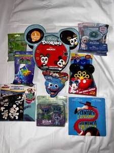 lot 14 image: Mickey Doorables, Stickers &Bubbles, Frozen Light up necklace, Cows & Aliens, Silly Sand & Stitch Toys