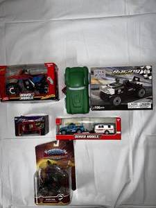 lot 22 image: Skylander Shark Tank, Teko Blox Racing, Denver Model Motorcycle, Truck Camper Trailer and Turbo Power Monster Truck