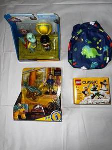 lot 24 image: Dino Ranch Figures, Imaginext Jurassic World Camp Cretaceous, Mini Dino Backpack& Classic Lego Set