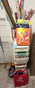 lot 32 image: Rolling Crafts Container with Holiday Wrapping Paper and More  BRING HELP TO REMOVE
