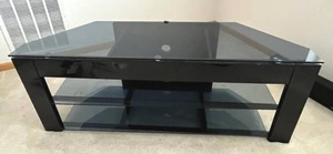 lot 245 image: Glass Top TV Stand (51 W x 16 D x 19 Tall) in Good Condition - BRING HELP AND EQUIPMENT TO REMOVE