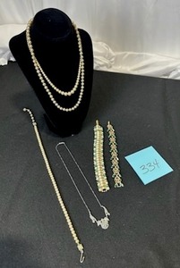 lot 334 image: Vintage Faux Necklaces & Costume Jewelry Lot - One of the bracelets is missing a few Rhinestones