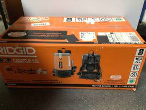 lot 48 image: RIDGID 6 Qt. NXT Backpack Vacuum Cleaner with Filters and Locking Accessories for Dry Applications Customer Returns See Pictures