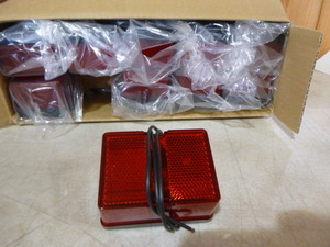lot 75 image: Case of Optronics Red Marker Lights