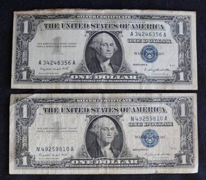 lot 22 image: (2) 1957 Silver Certificate $1 Notes