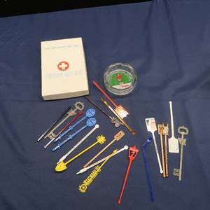 lot 20 image: VINTAGE THIRST AID KITSTIR STICKS AND GLASS ASHTRAY NEAT LOT