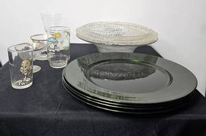 lot 137 image: Novelty Glasses, Divided 7 Serving Plate, Carmen Mikasa Crystal Cake Stand 13.5 Floral Pattern, Etched & Footed Crystal Bowl, (4) Large Green ChargersPlates