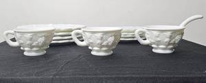 lot 141 image: 4 Westmoreland Milk Glass Paneled Grape 8 Plates, 3 Cups, 4 Saucers and 1 Serving Spoon