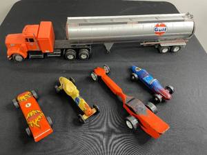 lot 162 image: Replica Toy Gulf Fuel Truck & 4 Soap Box Derby Race Cars