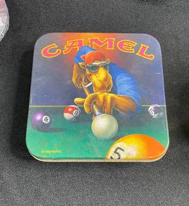 lot 251 image: Camel Logo Collectibles Inc Matches, Tins, Pin, (2) Ash Trays, Sunglasses, Lighter & More