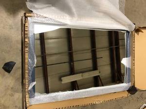 lot 25 image: Home Decorators Collection Sandon 46 in. W x 30 in. H Rectangular Framed Wall Mount Bathroom Vanity Mirror in Midnight Blue  Customer Returns See Pictures