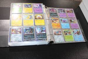 lot 38 image: Pokemon Binder with Holo RarePromoReverse Holo