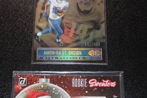 lot 93 image: 2021 Amon Ra St Brown Donruss Rookie Sweaters & Illusions Bronze 181499  Only 499 Exist