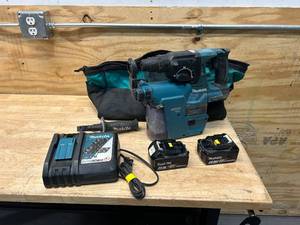 lot 87 image: MAKITA Hammer Drill with HEPA Filter, Charger, 2 Batteries and Bag