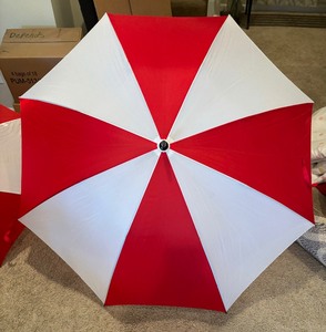 lot 56 image: Two Red and White Umbrellas
