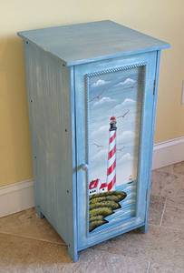 lot 14 image: Petite Wood Lighthouse Themed Storage Cabinet
