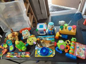 lot 74 image: Bin Of Popular Interactive Toys, Books & Blocks