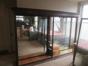 (DLR) Antique Display Case, Huge, Large Mirror Back Panels, Glass Ends (One Curved), No Cracks. 4 Front Doors (2 Cracked, Detached), 124x76x18, No Shelves. Bring Help For Removal No Assistance Provided.