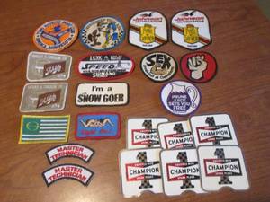 (K) Assorted Vintage Patches and 6 Champion Spark Plugs Stickers