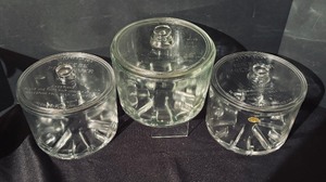 lot 250 image: Three Vintage Glass Sanitary Cheese Preservers