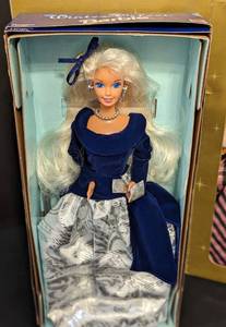 lot 34 image: Three Avon Winter Barbie Dolls