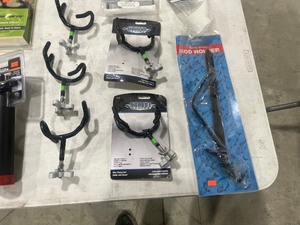 TABLE FULL OF ROD HOLDERS & BAIT HOLDERS