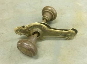 Old brass door knobs and new drawer pulls