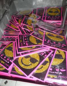 Box full of smiley face stickers