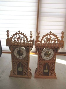 lot 32 image: Pair of 2 Vintage Wood Cut Out Mantel Pendulum Clocks.