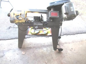 lot 174 image: 1991 4 12 Metal Band Saw with Blades.