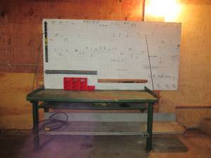 lot 175 image: 6 Ft. Steel Workbench with bottom 8 ft wood extended shelf.
