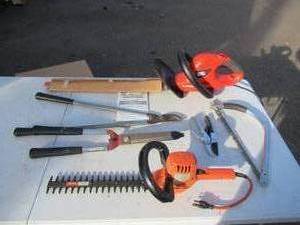 lot 217 image: Lot of Black & Decker Garden Tools Hedgehog, Saws, Trimmer, Clipper