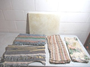 lot 383 image: Lot of various throw rugs, vintage fabric, large cutting board.