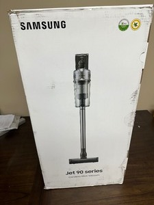 lot 17 image: Samsung Jet 90 Cordless Stick Vacuum Long Lasting Battery and 200 Air Watt Suction Power, Complete with Telescopic Pipe, Titan Silver Like New Factory Sealed