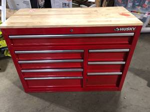 lot 8 image: Husky 42 in. W x 18.1 in. D 8-Drawer Red Mobile Workbench Cabinet with Solid Wood Top  Customer Returns See Pictures