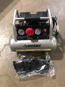 lot 31 image: Husky 1 Gal. Portable Electric-Powered Silent Air Compressor  Customer Returns See Pictures