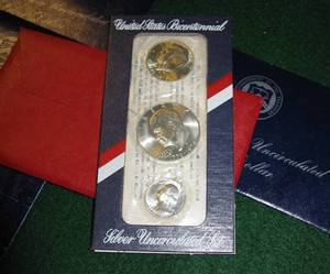 lot 331 image: 7 Uncirculated Eisenhower Silver Dollars and Bicentennial Silver Uncirculated Set